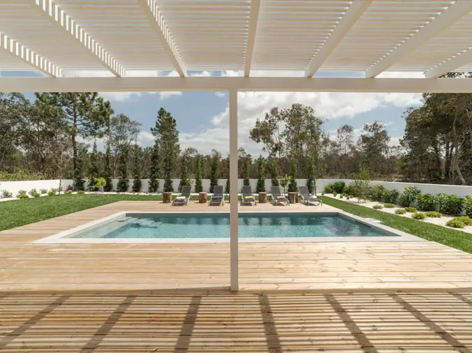 Rectangular pool with deck and pergola cover