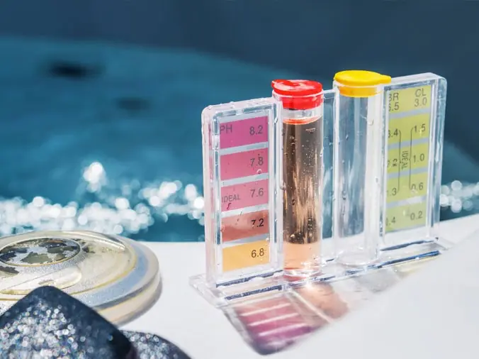 Pool testing kit on the site of a backyard pool