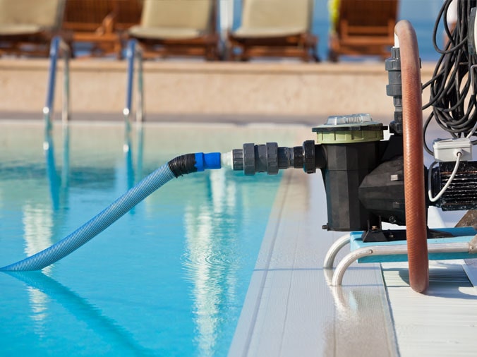 Pool vaccum on the side of a private pool