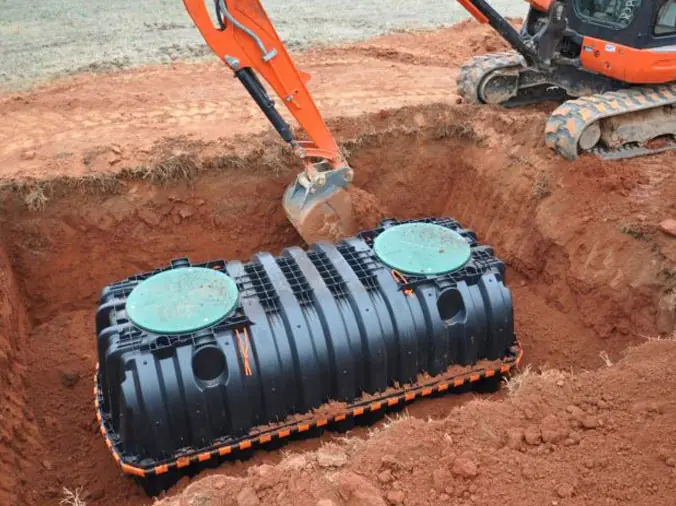Septic tank placed in hole in ground